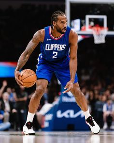 a basketball player dribbling the ball during a game