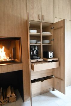 an open cabinet with a fire in it