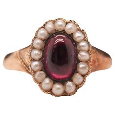 Year: 1863 (Engraved on inner shank) Item Details: Ring Size: 7 Metal Type: 9k Yellow-Rose Tone Gold [Hallmarked, and Tested] Weight: 3.0 grams Center Details: Tourmaline, Deep Purple, 7.7mm x 5.25mm, Natural Side Stone Details: Seed Pearls, 2mm each. Band Width: 2.55mm Condition: Excellent Victorian Melo Pearl, Antique Garnet Ring, Etruscan Jewelry, Victorian Engagement Rings, Rose Tone, Garnet Jewelry, Jewelry Lookbook, Garnet Rings, Jewelry Rings Engagement