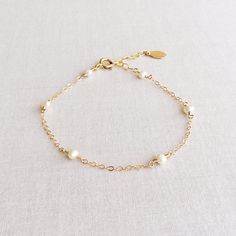 Dainty Pearl Bracelet Pearl Bracelet Gold Pearl Bracelet Classic Pearl Charm Chain Bracelet For Wedding, Dainty Wedding Jubilee Charm Bracelet, Dainty Hypoallergenic Charm Bracelet For Weddings, Dainty Pearl Chain Bracelet With Jubilee Style, Dainty Pearl Charm Bracelet Adjustable, Adjustable Pearl Charm Bracelet For Bridesmaids, Classic Pearl Bracelet With Extender For Gift, Elegant Pearl Charm Bracelet For Wedding, Adjustable Pearl Chain Bracelet For Bridesmaid Gift