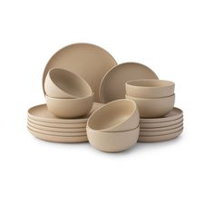 a set of beige dishes and bowls on a white background