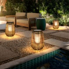 some lights that are next to a pool