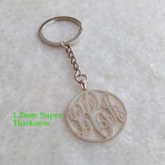 the monogrammed keychain has two initials on it