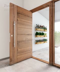 an open wooden door with planters on the wall and glass doors leading to another room