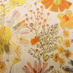 an orange and yellow floral pattern on fabric