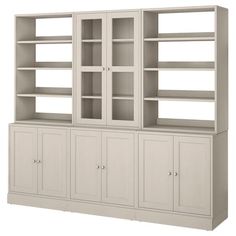 a white bookcase with two doors and three drawers