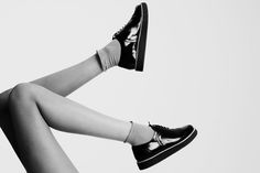 black and white photograph of woman's legs with high heels