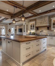 a large kitchen with an island in the middle and lots of cabinets on both sides