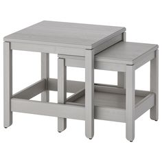 two small tables sitting next to each other on top of each other, one is gray and the other is white