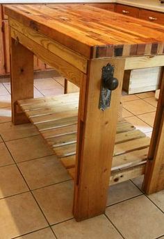 a small wooden table sitting on top of a tiled floor