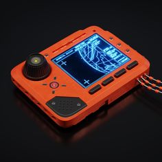 an orange handheld game system on a black surface with a red cord attached to it