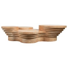 a set of four wooden trays sitting on top of each other