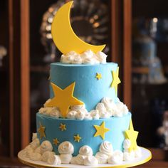 a blue and yellow cake with stars on it