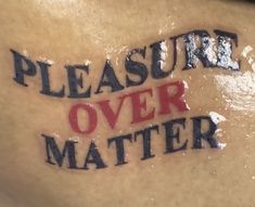 a close up of a person's stomach with the words pleasure over matter written on it