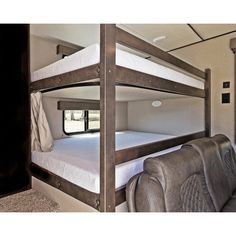 the bunk beds in this rv are made to look like they have no mattresses