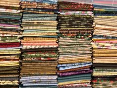 many different fabrics are stacked on top of each other