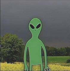 an alien standing in the middle of a field