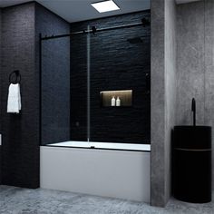 a black and white bathroom with a glass shower door