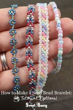 three beaded bracelets in different colors and sizes on a person's hand