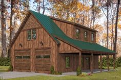 a two story garage with a green roof