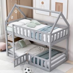 a child's bunk bed with a soccer ball on the floor