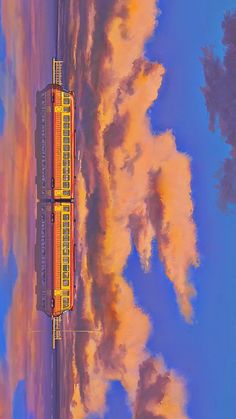 an image of a train going down the tracks with clouds in the sky behind it