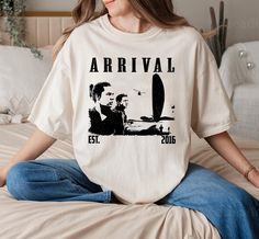 Arrival Movie Shirt, Arrival Shirt, Retro Film Shirt, Vintage TShirt, Retro Shirt, Classic Shirt, Gifts for him, Christmas Gifts T-Shirt: Bella Canvas 3001 or Gildan (Usually we will ship Bella Canvas but when out of stock we will switch to Gildan) T-Shirt Comfort: Comfort Color Brand Sweatshirt: Gildan 18000 Hoodie: Gildan 18500 Thank you for shopping. Currently due to the upcoming Christmas, the USPS, UPS, Fedex... delivery services are overloaded so there will be some unexpected delays, I hop Arrival Movie, Gifts For Him Christmas, Retro Film, Movie Shirts, Retro Shirts, Classic Shirt, Vintage Tshirts, Festival Season, San Jose