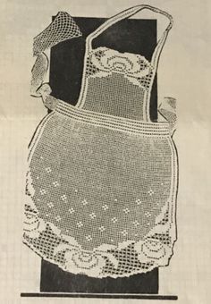 an old fashioned crocheted apron with lace on it