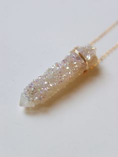 "Featuring a single beautiful Angel Aura Spirit Quartz Raw stone which was handcrafted into a 14k gold filled bezel set pendant piece. The stone has a pretty natural sparkle. This necklace highlights the beautiful elements of this arresting stone. The stone measures approx. 1.25\" long and 15mm wide. Chain is 18\" long. Handmade in my California studio This is a Limited Edition Piece Edition! Please allow for natural variation in crystals. No two are the same. They are unique just like you! Each Angel Aura Crystal, Raw Crystal Necklace, Spirit Quartz, Aura Crystals, Angel Aura Quartz, Beautiful Angel, Color Corrector, Angel Aura, Edgy Wallpaper