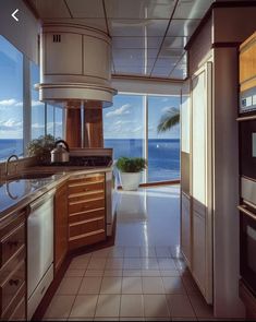 a kitchen with an ocean view is shown