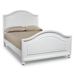 a white bed with drawers underneath it and a pillow on the top of the bed