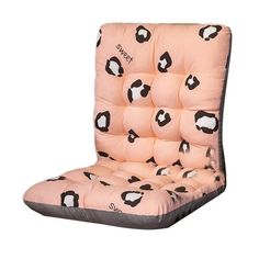 a pink chair with black and white sheep on it's seat cushion, sitting in front of a white background