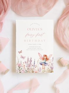 a pink birthday card with a fairy tinker on it next to flowers and butterflies