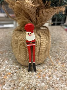 a nutcracker ornament on top of a burlock wrapped sack