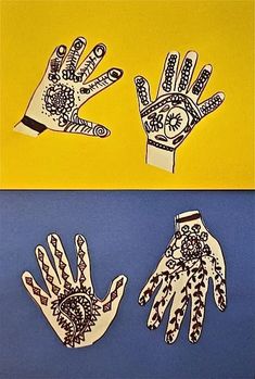 paper cutouts of two hands with designs on them