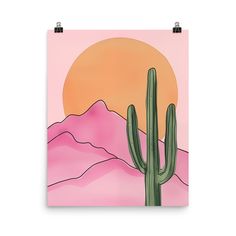 a pink poster with a cactus in the foreground and mountains in the back ground