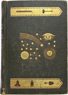 an old book with gold stars and eyes