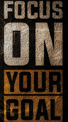 a poster with the words focus on your goal written in black and yellow letters, against a dark background