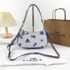 ◉ COACH Teri 2Way Shoulder Bag Signature Canvas Blueberry Print CR292 outlet New [Specifications] Shoulder bag made with the brand's unwavering craftsmanship Signature coated canvas, smooth leather 2 card slots Multi-function pocket inside Zip top closure, lined Detachable handle, 21cm shoulder to to-body length Detachable strap, 58cm shoulder to to-body length (2-way design for shoulder and crossbody wear) *You can change the strap to your liking by replacing it with a strap sold separately. [Size] 15.5cm x 24.5cm x 7.5cm Can hold a Coach long wallet *The images and videos may differ slightly from the actual product in terms of color, specifications, size, etc. Style No. CR292 ◇ Notes This product was purchased at an outlet store. Please rest assured that it is brand new. [About outlet pr Blueberry Print, Cute Wallets, Coach New York, Signature Canvas, Outlet Store, Women Accessories Bags, Long Wallet, Zip Top, Casual Bags