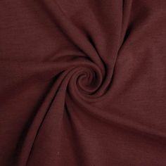 a close up view of a maroon fabric