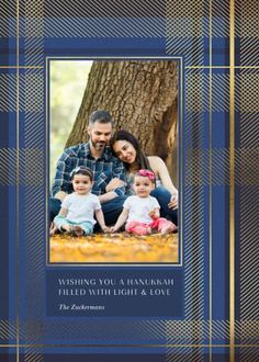 a blue plaid photo frame with the words wishing you a hanukkah filled with light and love