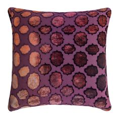 a purple pillow with brown spots on it