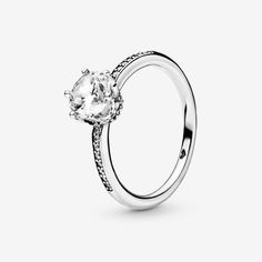 Bring an explosion of sparkle to your outfits with the sterling silver Clear Sparkling Crown Ring.  The claw setting of the large clear cubic zirconia creates the effect of a regal crown on the solitaire ring and is complemented by additional small stones set along the ring band. A ring that’s fit for the special princess or queen in your life, it can be paired with most other selections from the Pandora collection for a truly regal look. - Pandora Clear Sparkling Crown Solitaire Ring - Sterling silver / Cubic Zirconia / Clear - Sz. 8.5 Pandora Collection, Claw Setting, Pandora Rings, The Claw, Crown Ring, Jewellery Uk, Small Heart, Ring Band, Pandora Jewelry