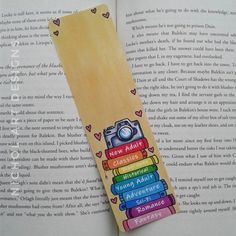 a bookmark made out of books with a camera on top