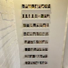 a white wall with several pictures on it