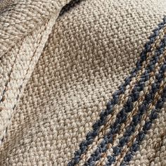 closeup of the texture of a blanket with blue and brown stripes on it,