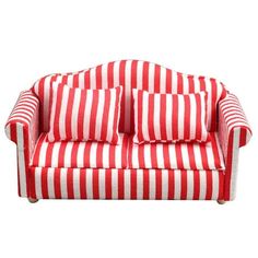 a red and white striped couch with two pillows