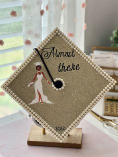 a graduation cap with an image of a woman on it