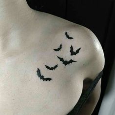 a woman's chest with bats on it