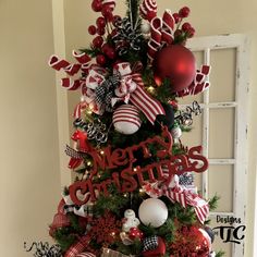 a christmas tree decorated with red and white ornaments